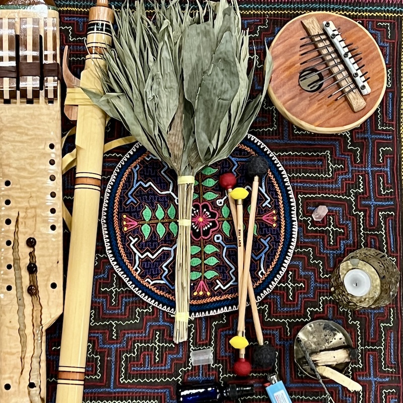photo of an altar with instruments and Shipibo designs.